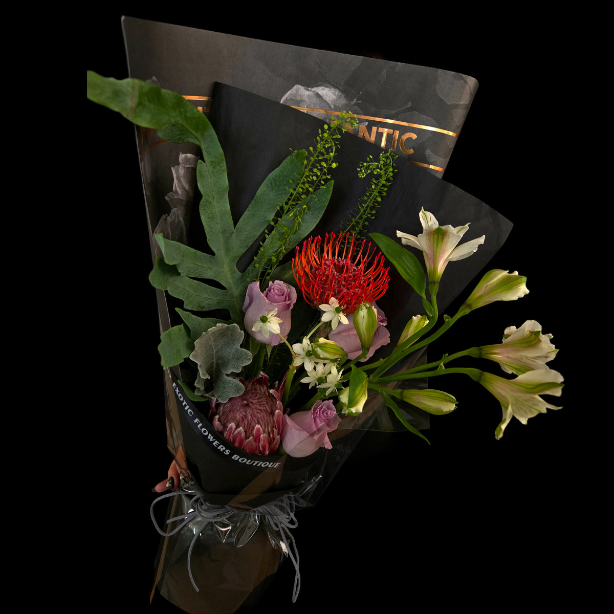 Whisper of the Night – Red Pincushion Protea & Lilac Rose Bouquet