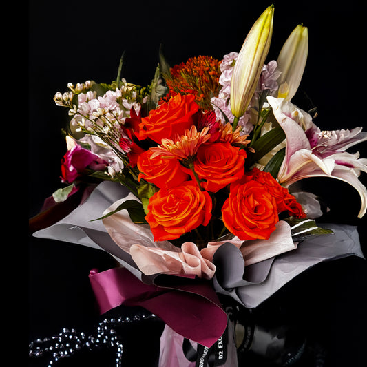 Amber Bliss – Orange Rose & Lilac Lily Bouquet