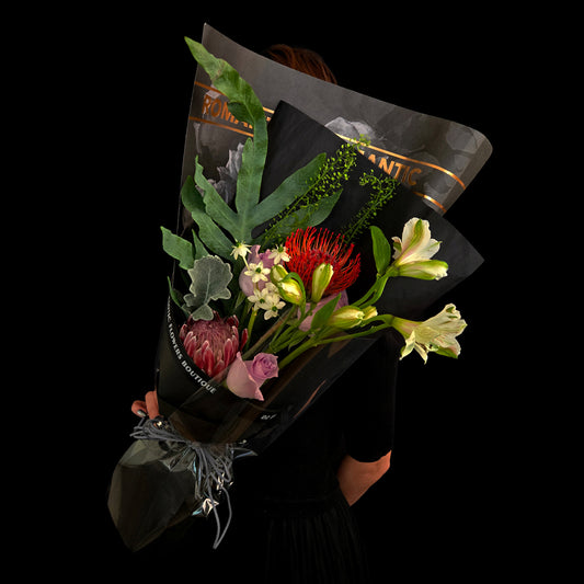 Whisper of the Night – Red Pincushion Protea & Lilac Rose Bouquet