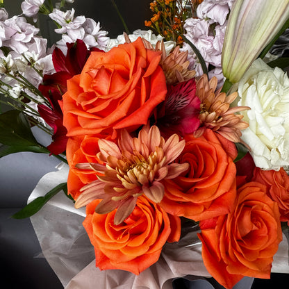 Amber Bliss – Orange Rose & Lilac Lily Bouquet